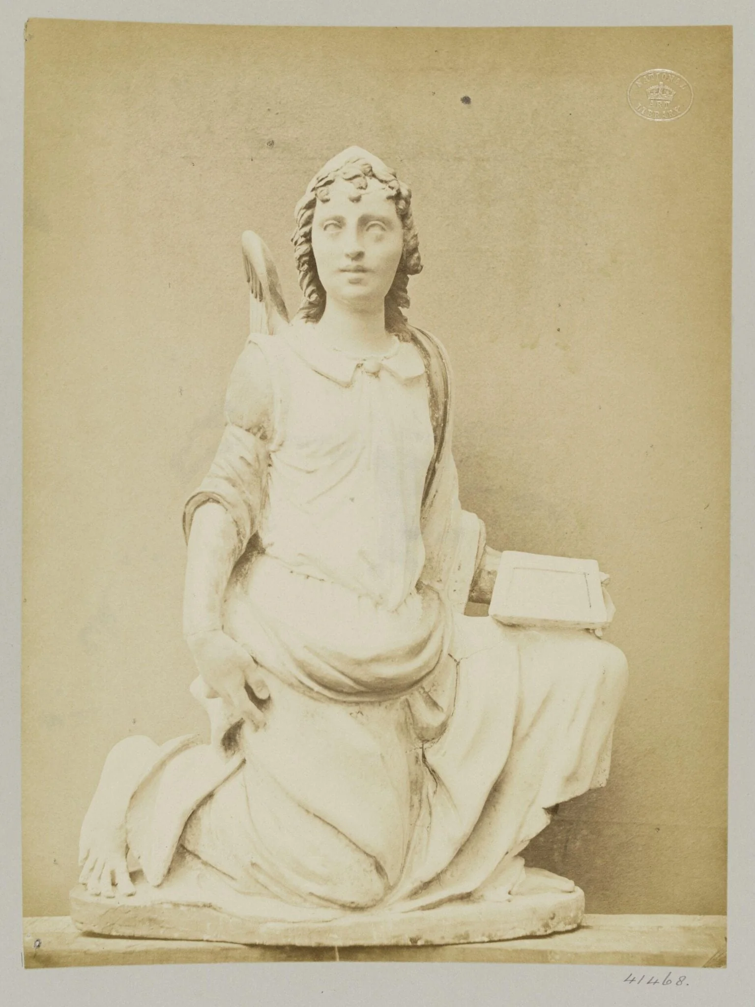 Figure of an Angel Kneeling, enamelled earthenware