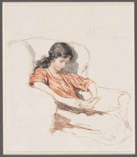 A girl reading in an armchair
