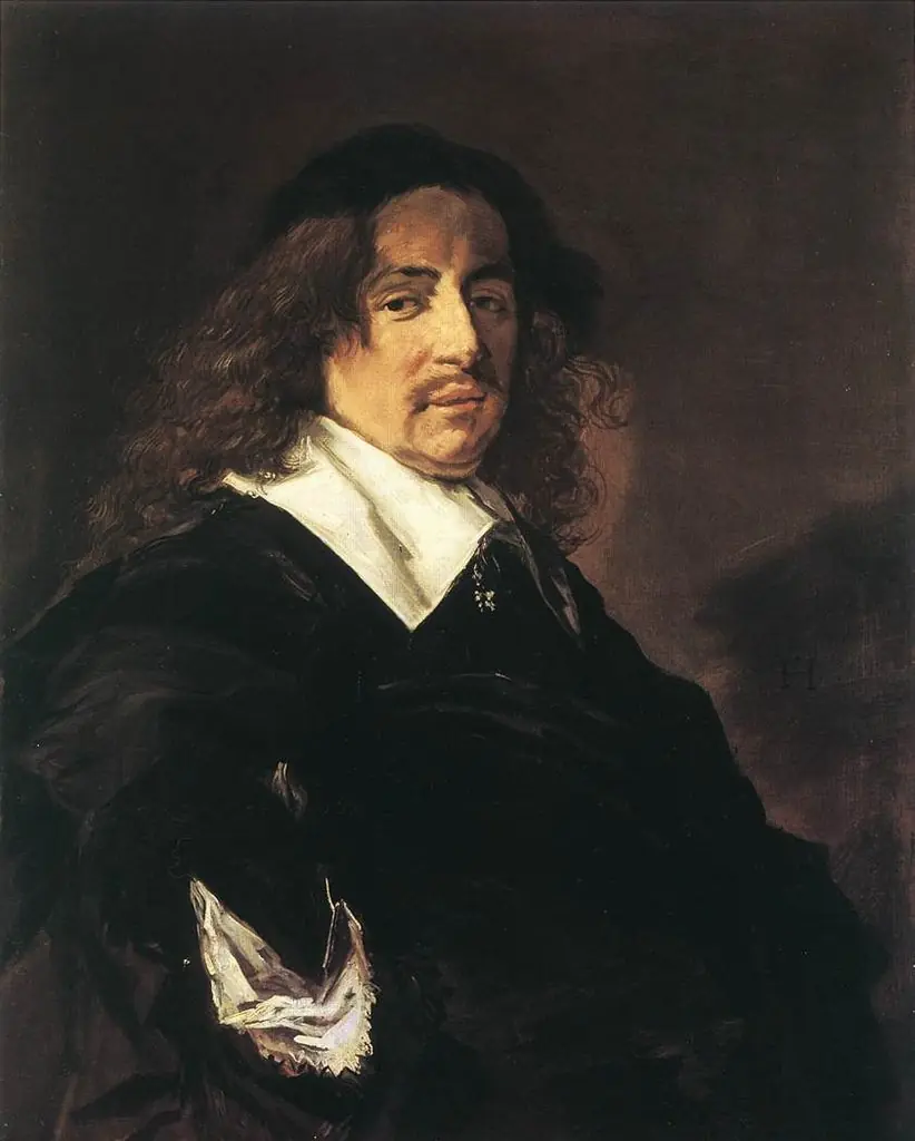 Portrait of a man with long hair and a mustache