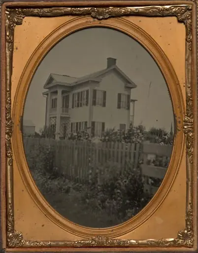 Homestead with picket fence and flowers