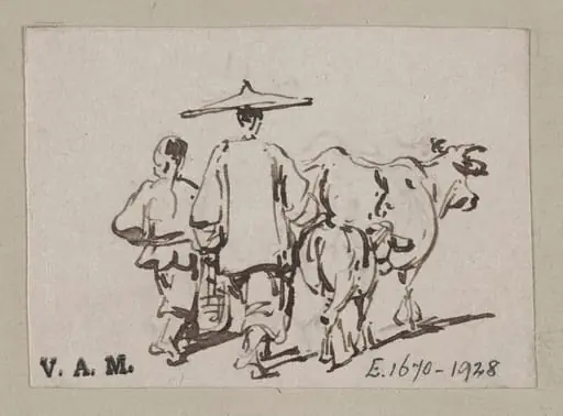 A man and a boy driving cattle