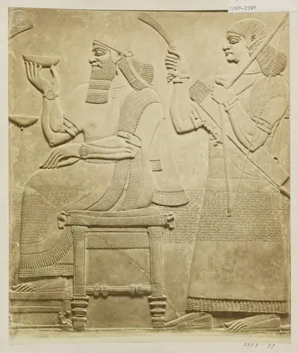Sculpture, relief of figure seated with attendant. London: British Museum