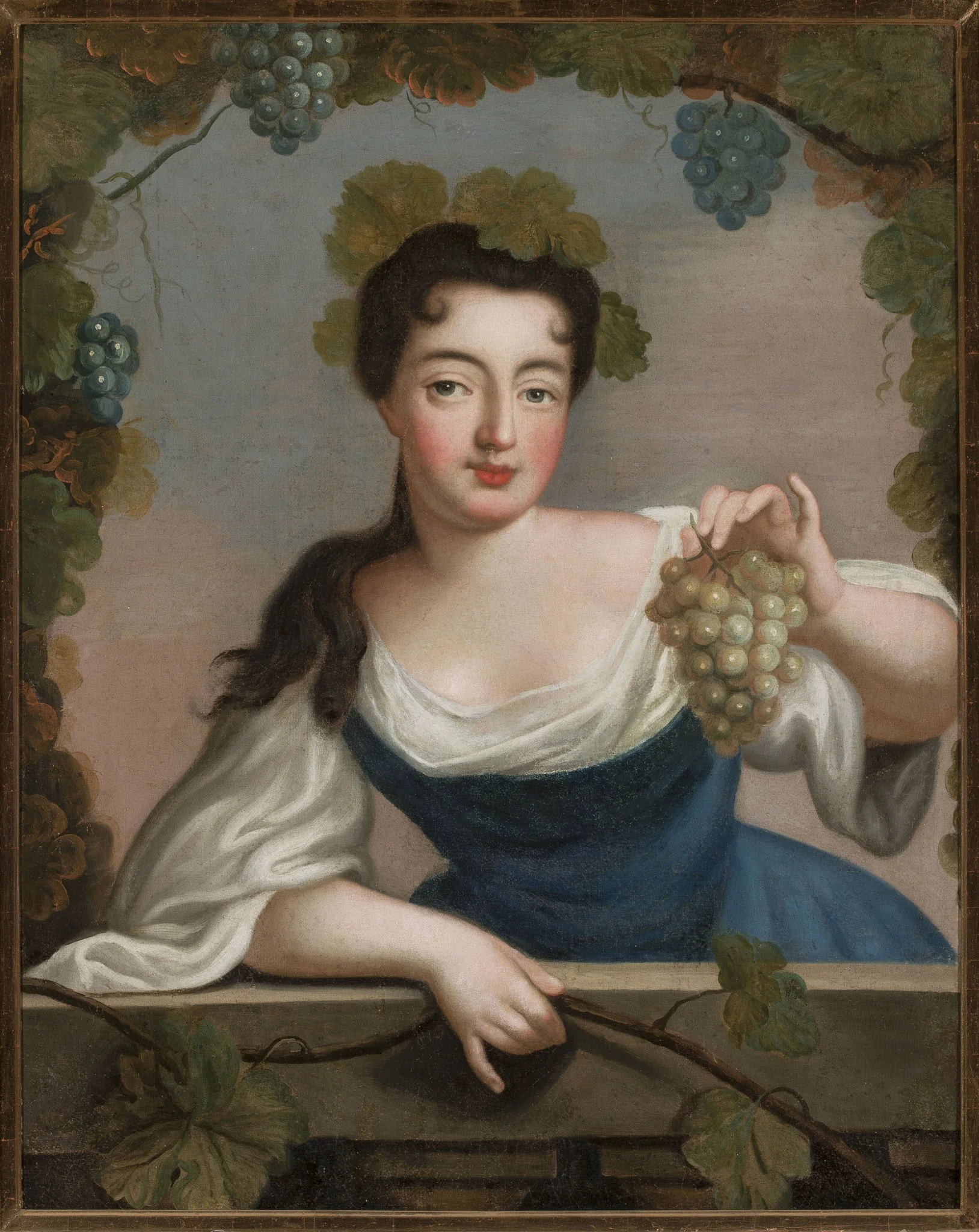 Woman with a bunch of grapes