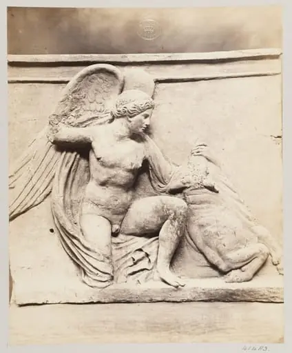 Winged figure slaying a bull in terra cotta